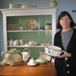 Suzanne in front of some of her lovely ceramics