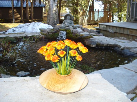 Turned flowers in a cedar vase